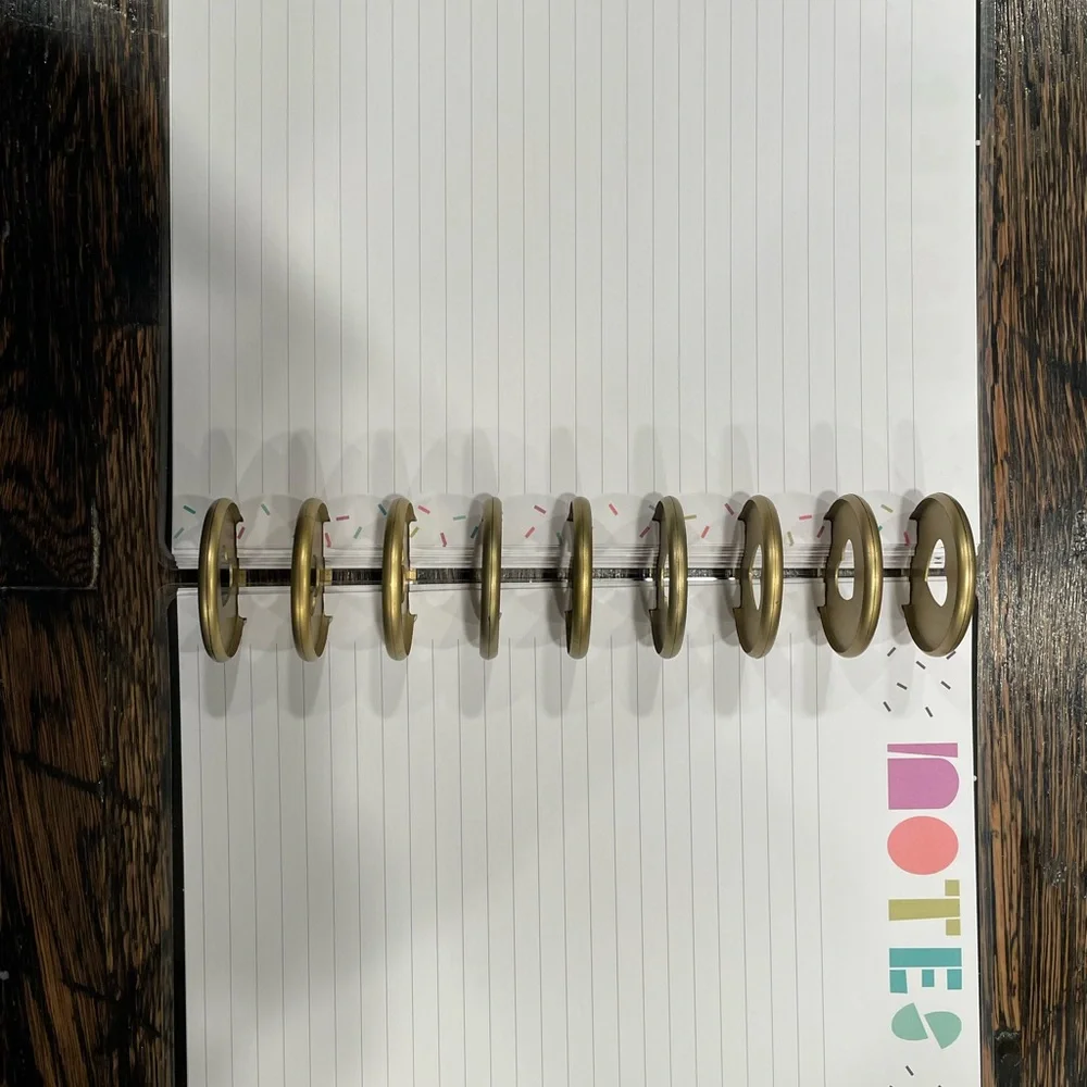 The Happy Planner Colorful Wave Calendar -mix of pages, rings, monthly dividers.